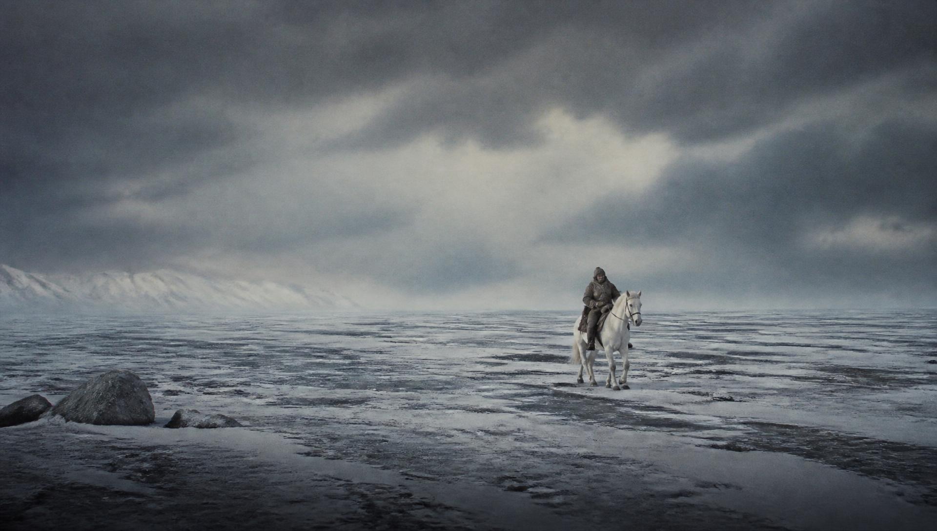 A lone rider on a white horse crossing a vast frozen Mongolian steppe under a bruised winter sky
